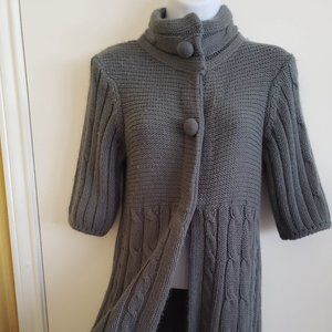 Super cute knee-length sweater. Will fit sm/md.